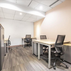 Modern windowless private office room with desks and storage, Central Plaza, Wan Chai, Hong Kong.