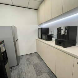 Modern office pantry featuring coffee machine and sleek cabinetry, Lippo Sun Plaza, Hong Kong