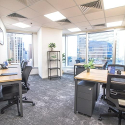 Modern open-plan workspace featuring large windows with city views, Hysan Avenue, Hong Kong.
