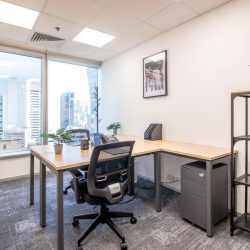 Private team office space with desks and views of Causeway Bay, Hong Kong.