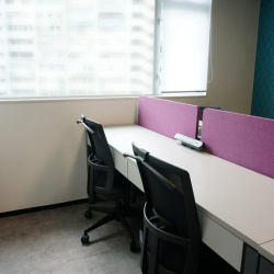 Workspace with desks and purple dividers at Roxy Industrial Centre.