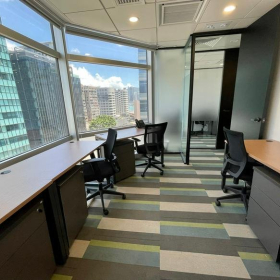 Bright coworking space with large windows and city views, Lippo Sun Plaza, Hong Kong. Click for details.